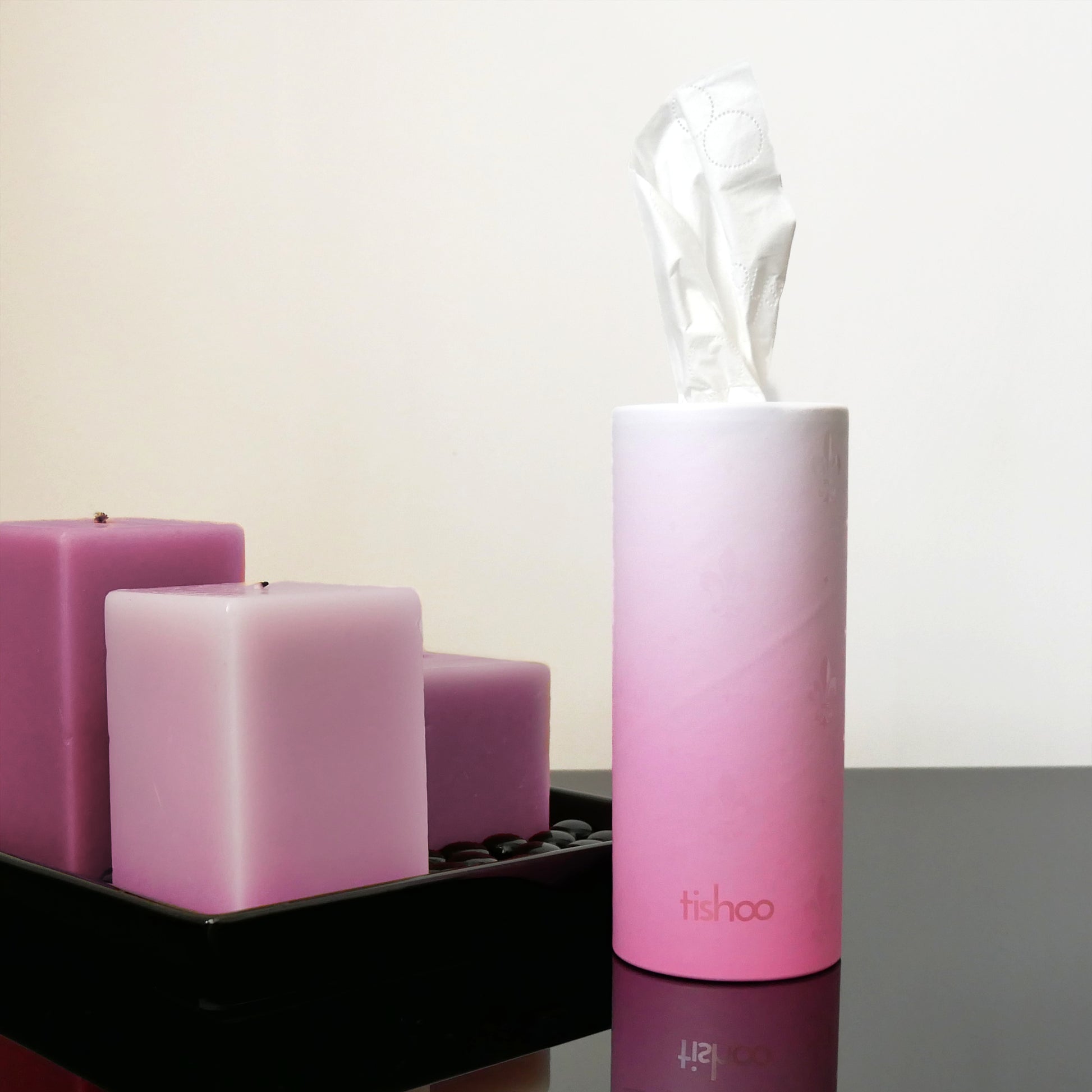 tishoo Luxury Tissues Pink/Rose design on table next to candle